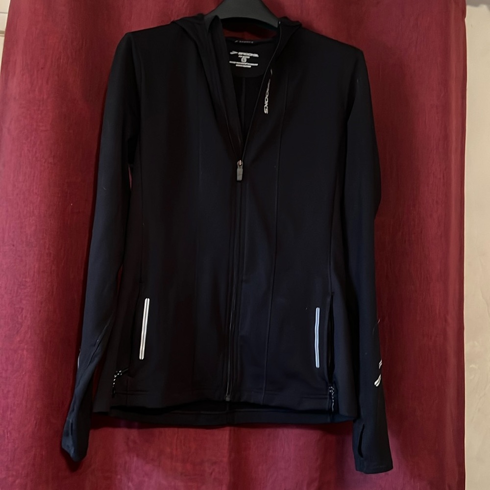 Brooks running hoodie with ponytail hole in hood.  Reflective accents for safety